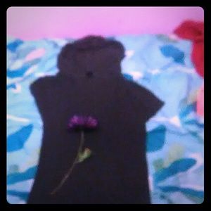 A grey dress that has a hood.